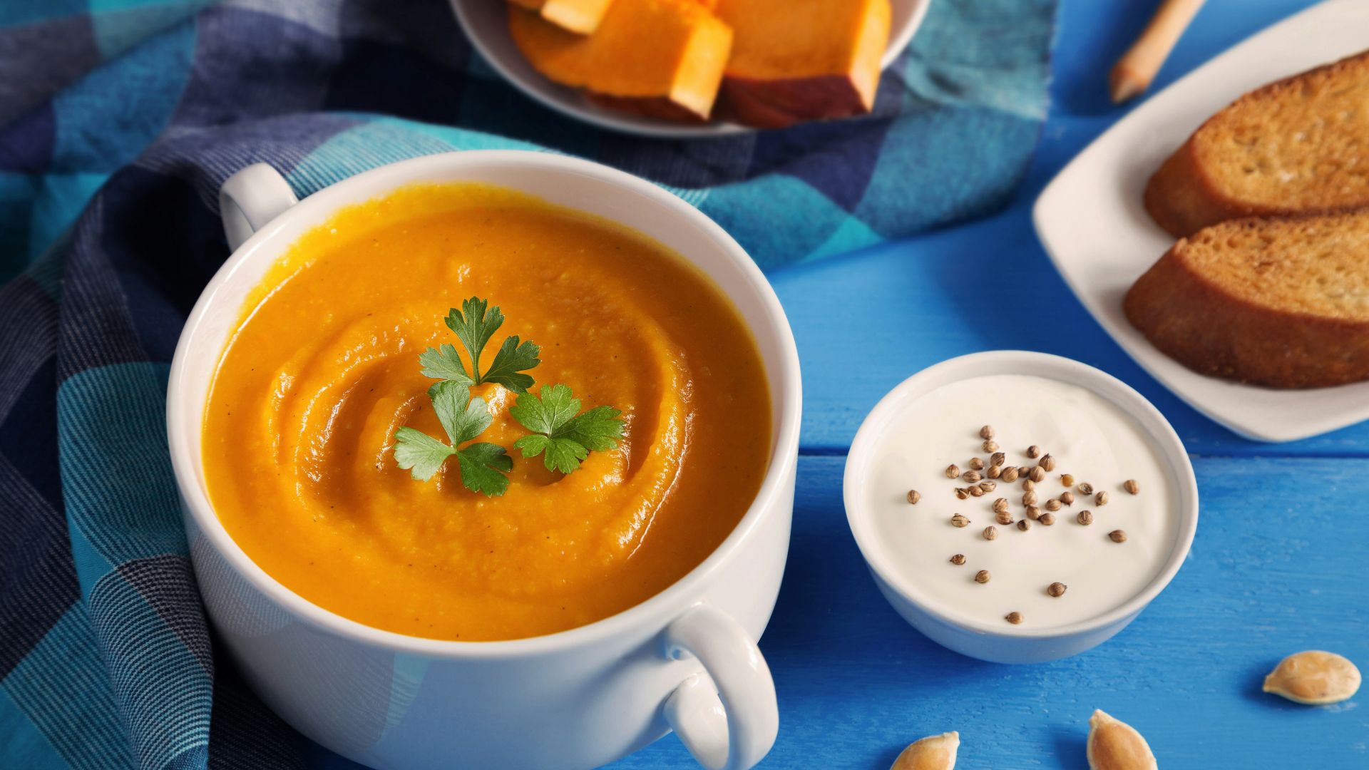 a cup of tea next to a plate of pastries