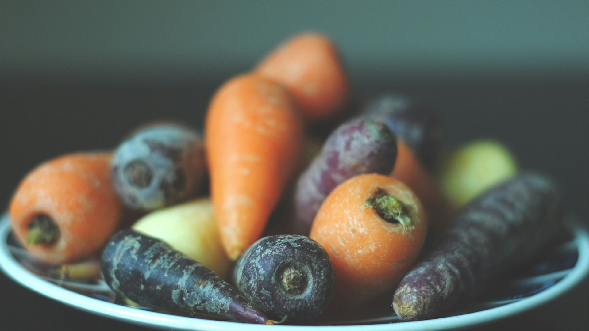 bunch of carrots on white plate