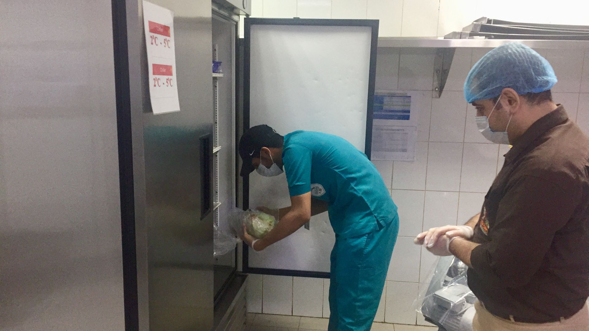 File:Health Inspector checking in a restaurant.jpg