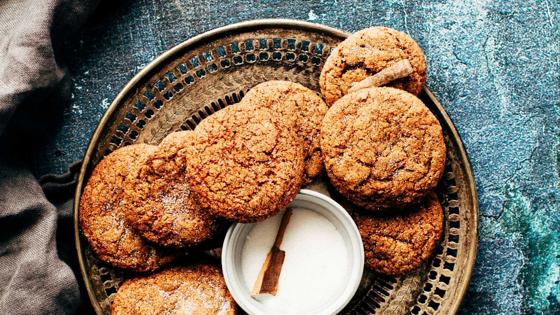 platter of cookies on top of blue surface
