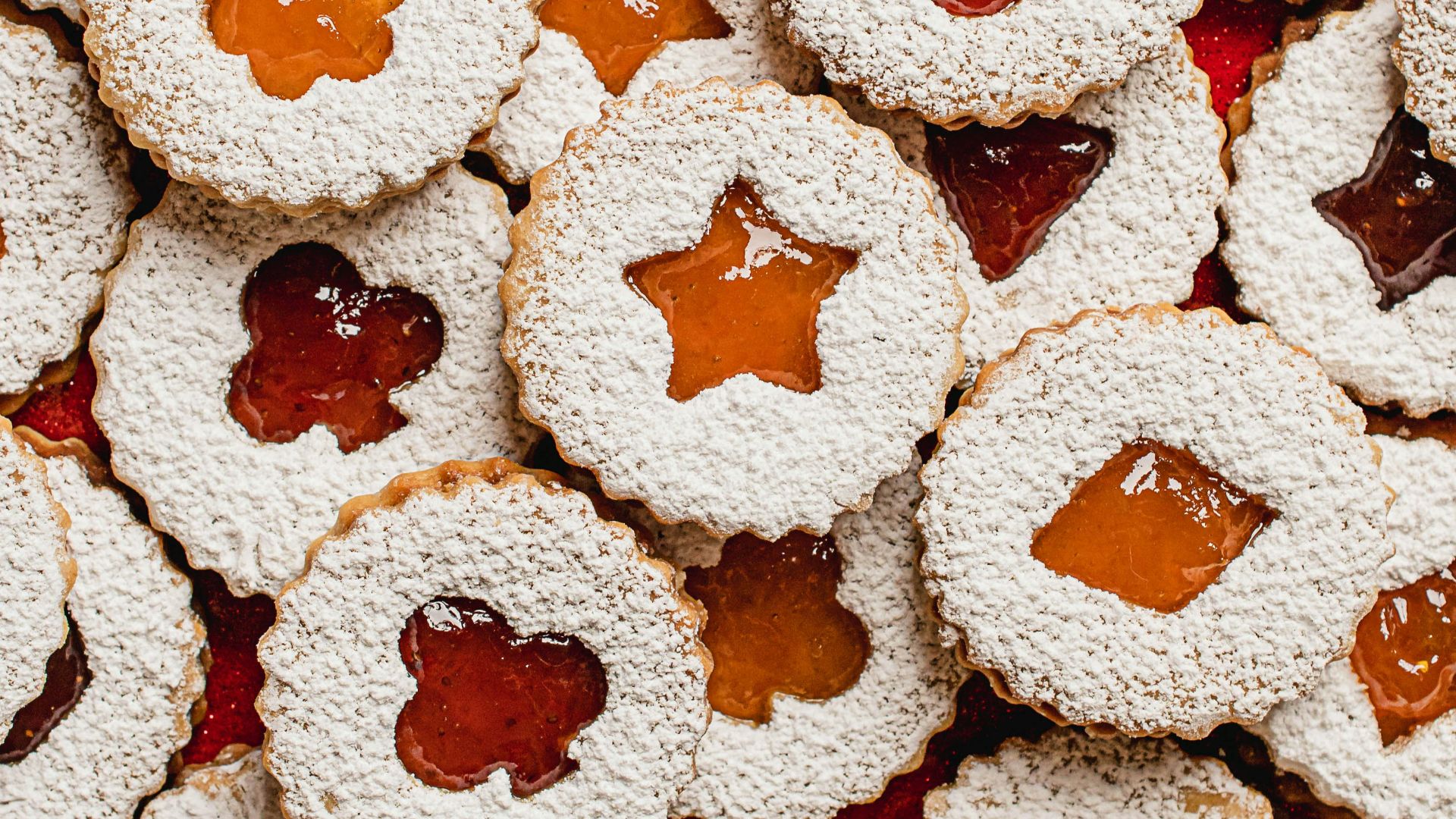 a pile of cookies with jam on them