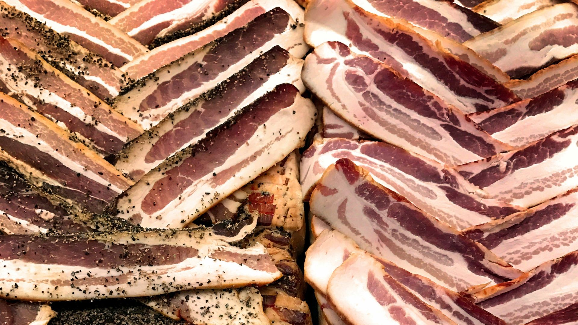 a pile of bacon sitting next to each other