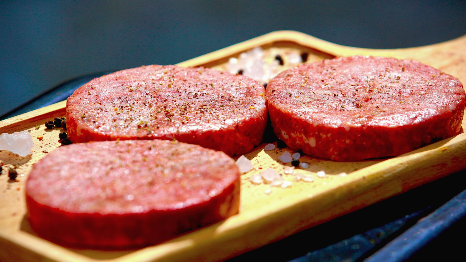 brown bread with red sauce on brown wooden tray