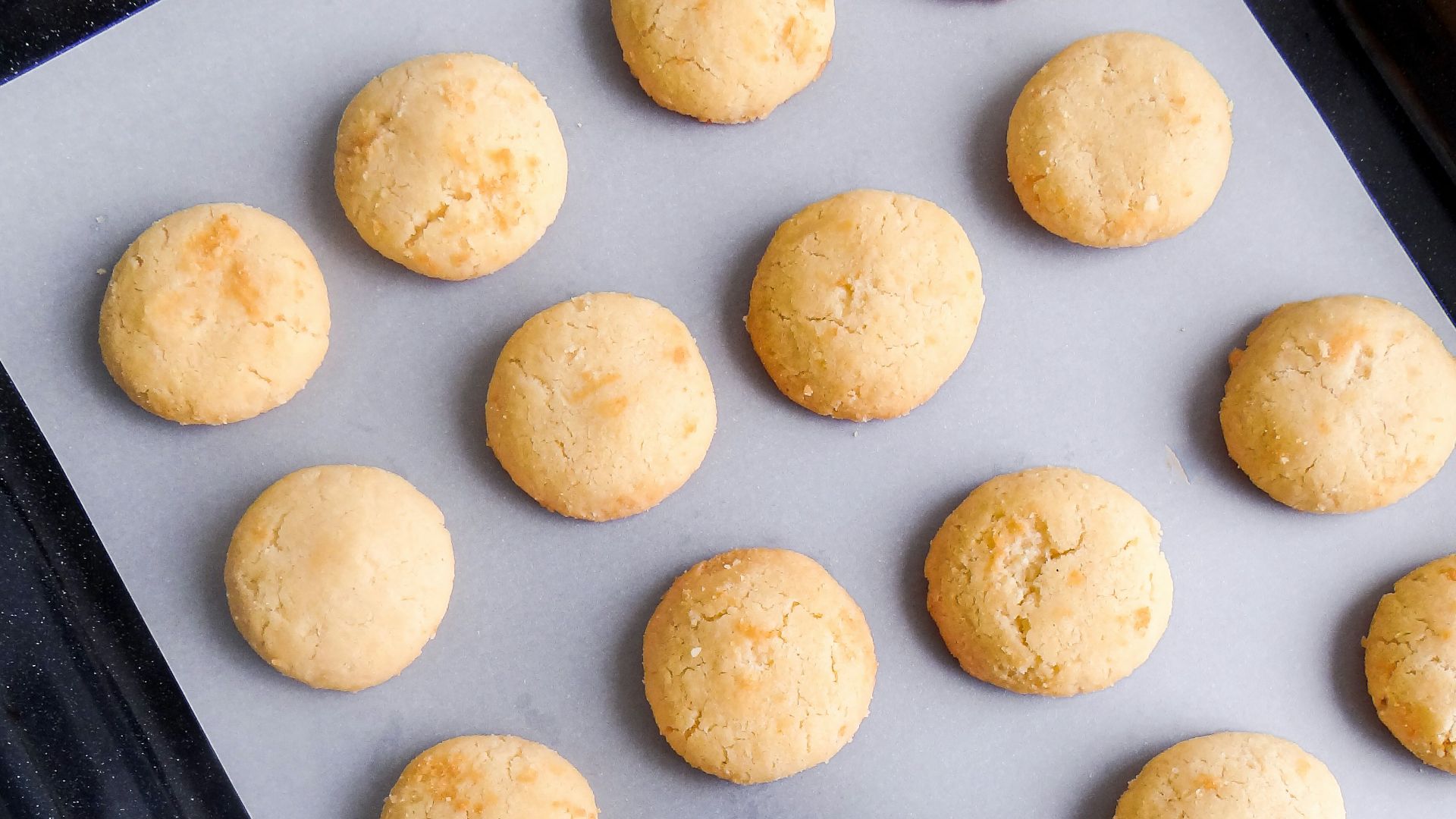 A pan filled with cookies and a spatula