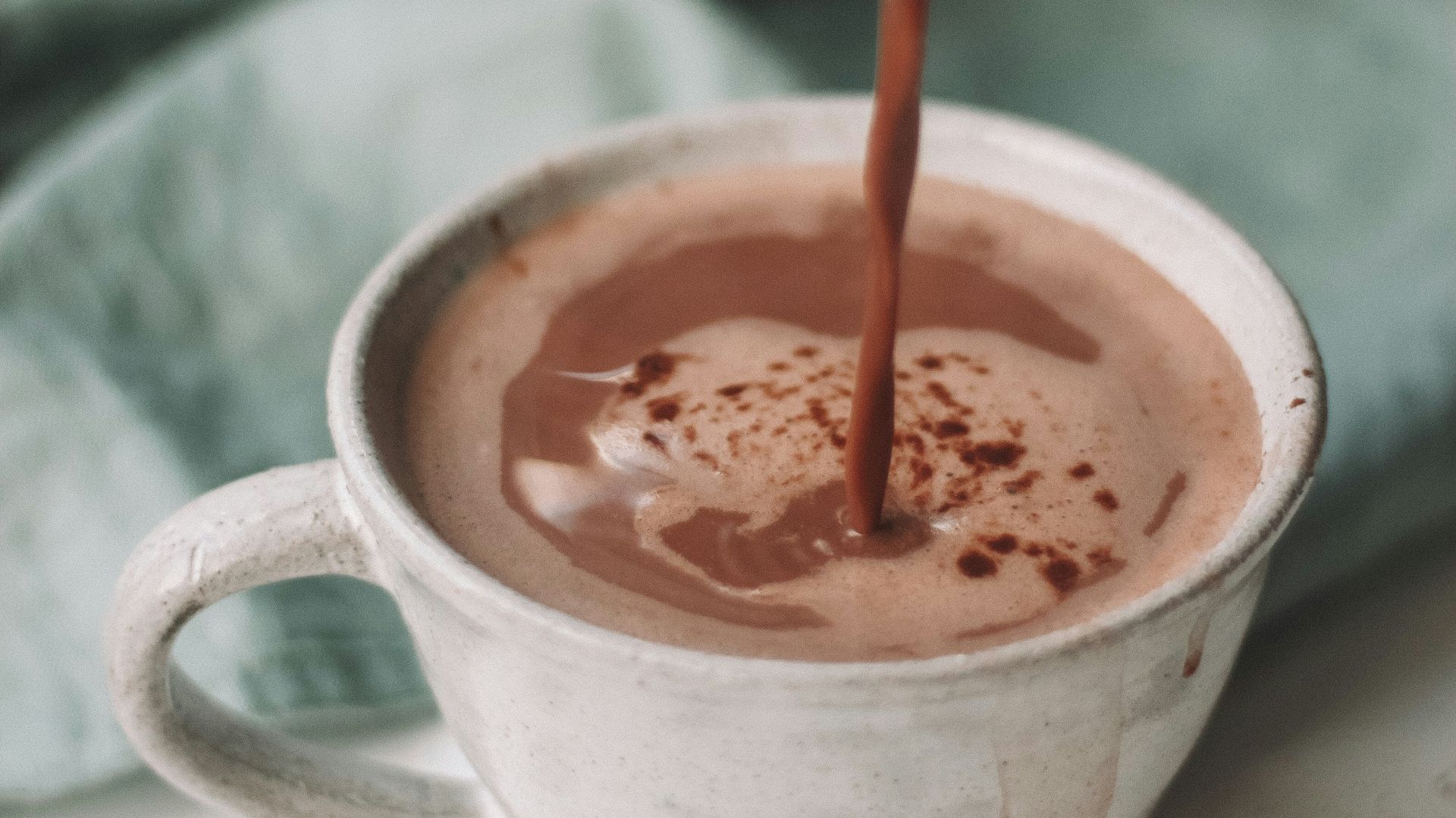 chocolate coffee pouring in white mug
