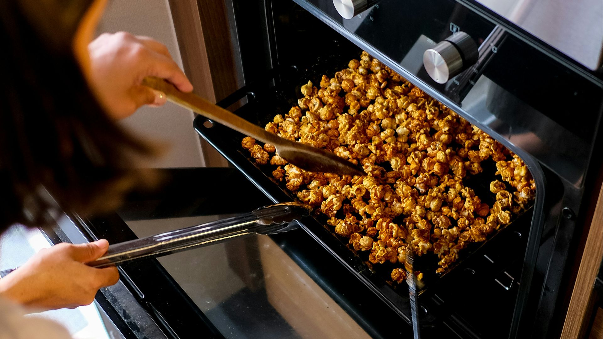 person holding brown wooden stick