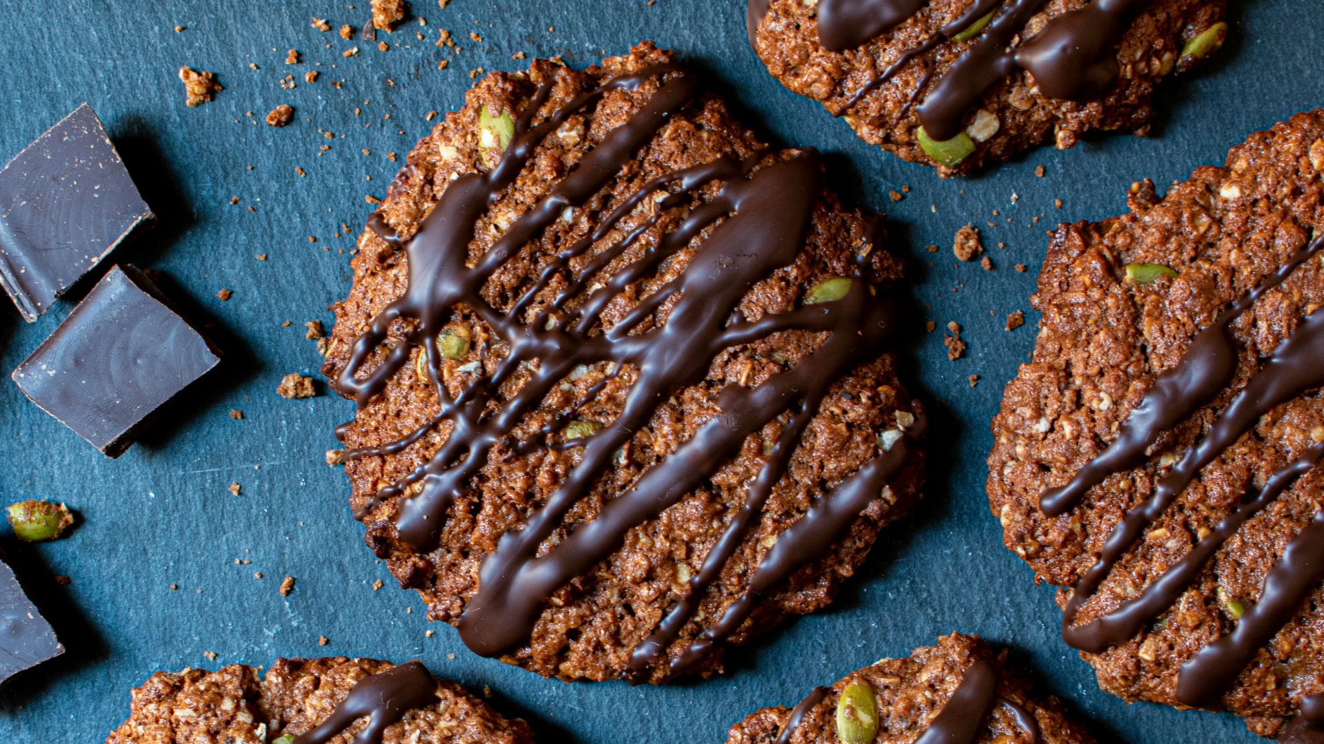 cookies with chocolate drizzled on top of them
