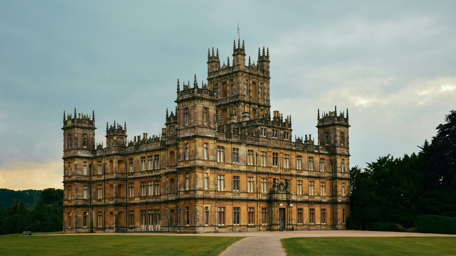 brown concrete building under white clouds during daytime