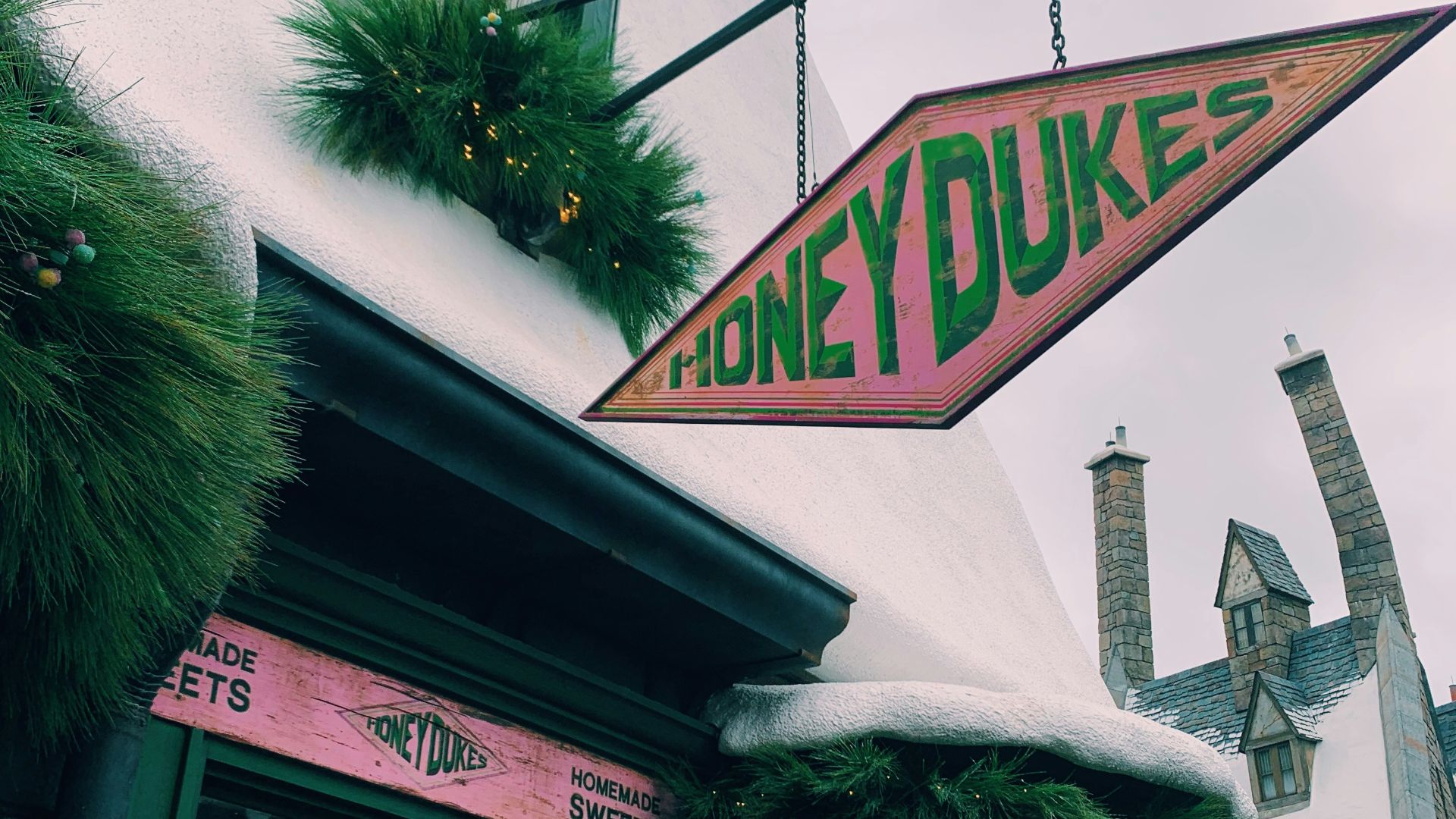 green tree near white concrete building