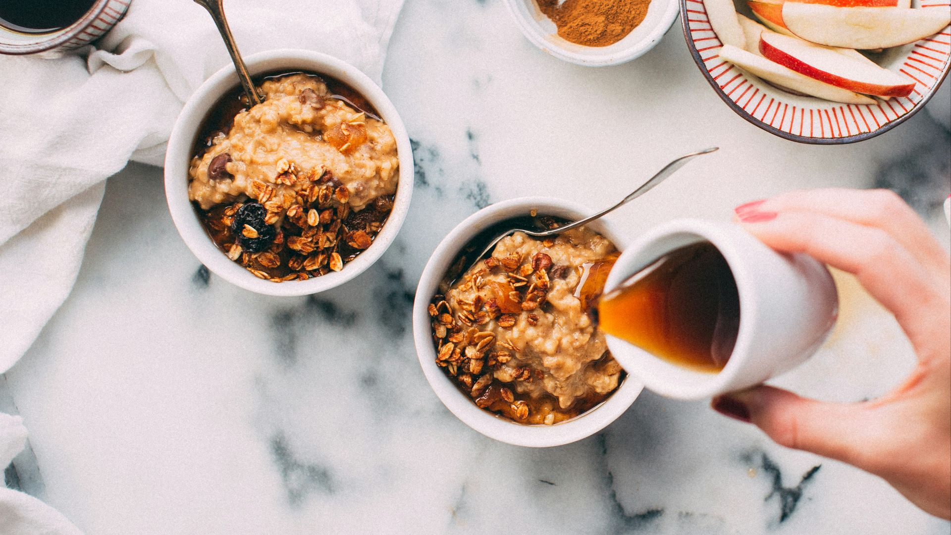 person holding white ceramic cup