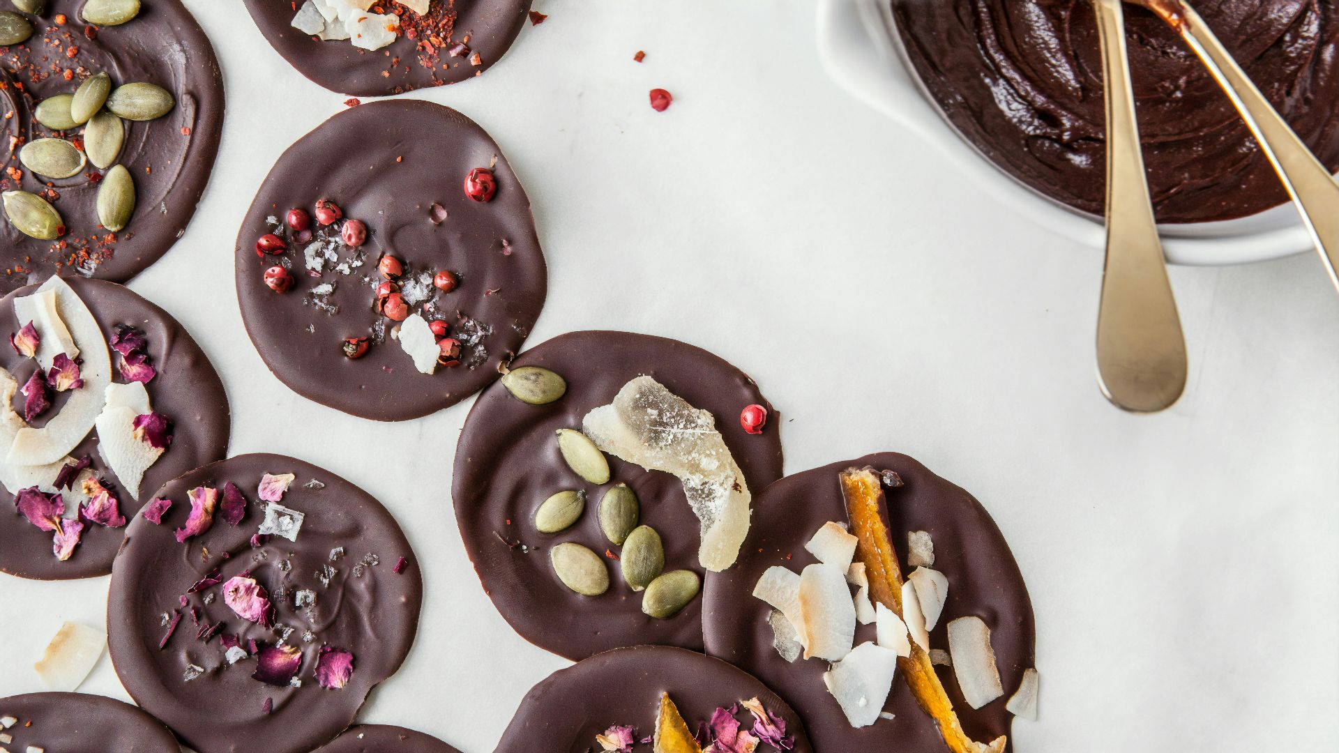 chocolate coated doughnut on white ceramic plate