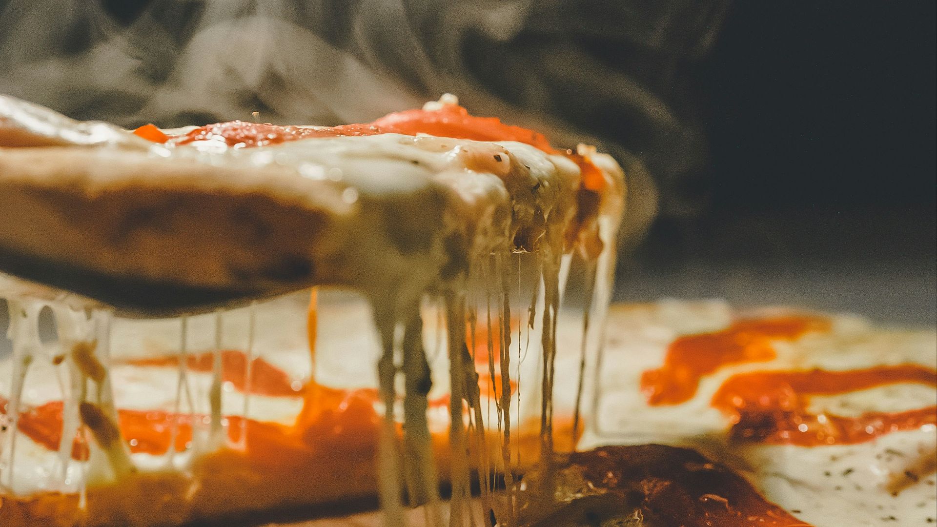 close up photo of pizza with cheese