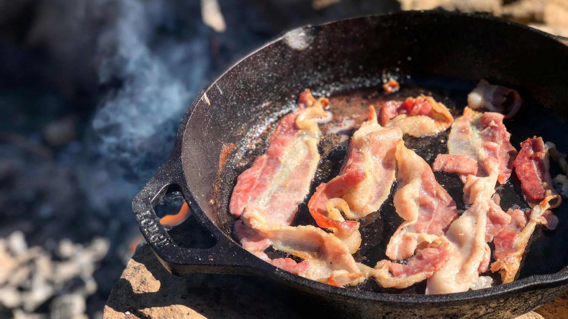 fried bacon in frying pan