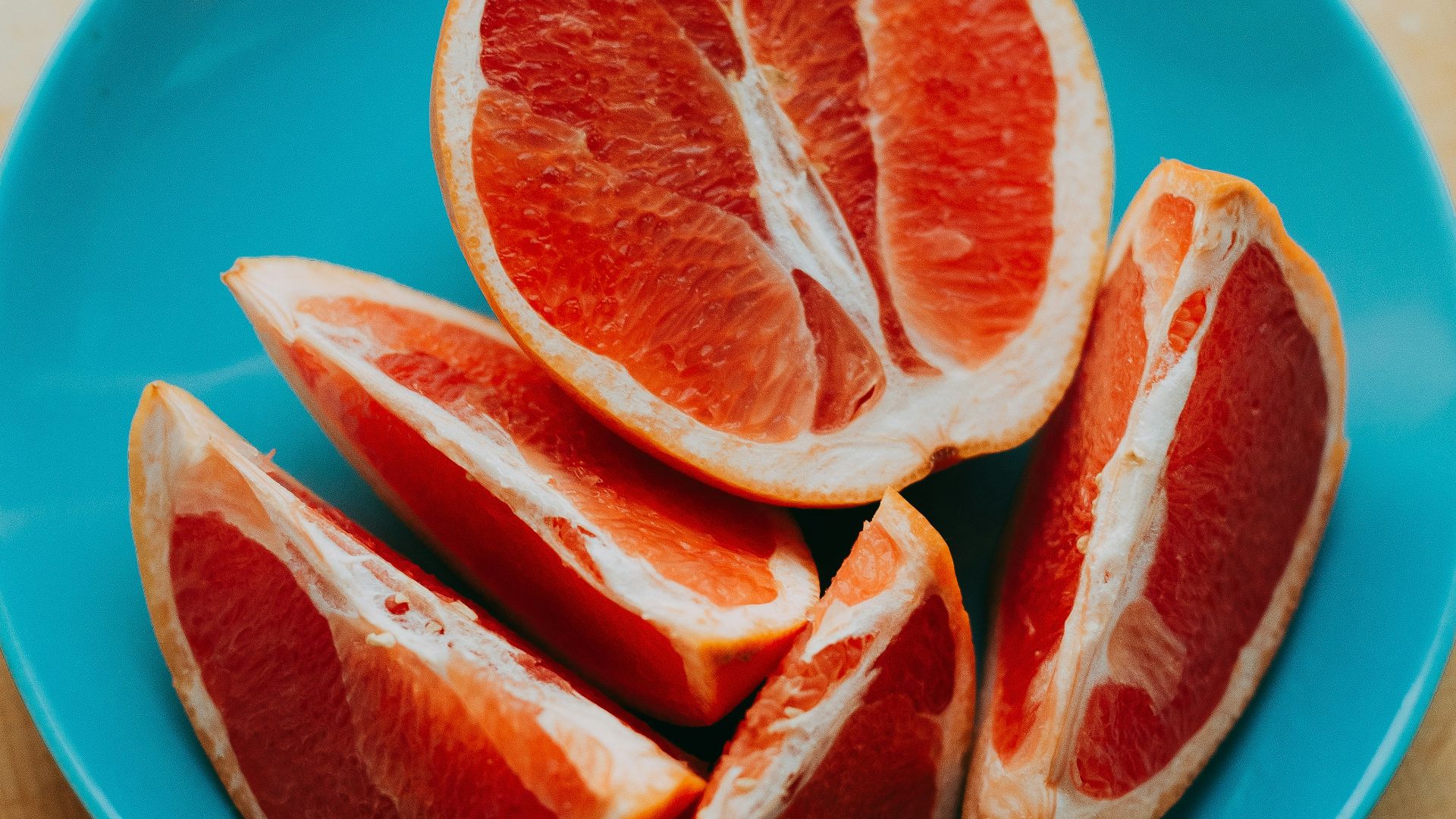 slice fruits on blue plate