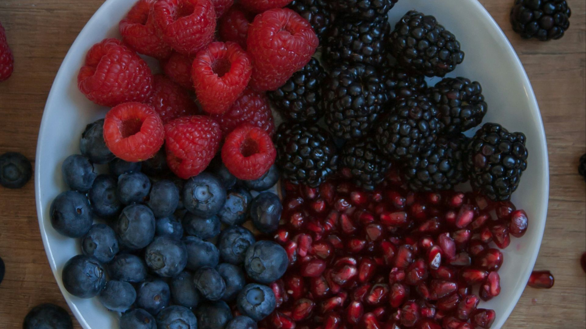 strawberries on white ceramic bowl