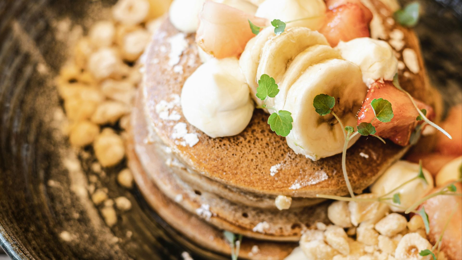 brown and white dish on black ceramic bowl