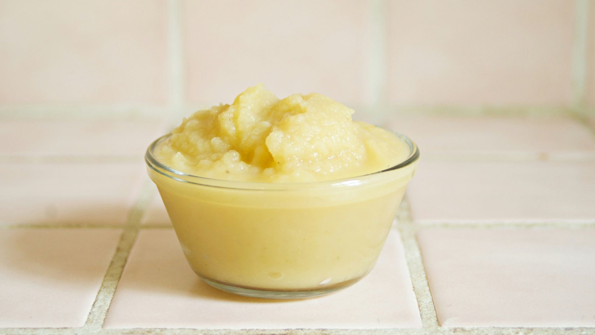 yellow cream in clear glass bowl