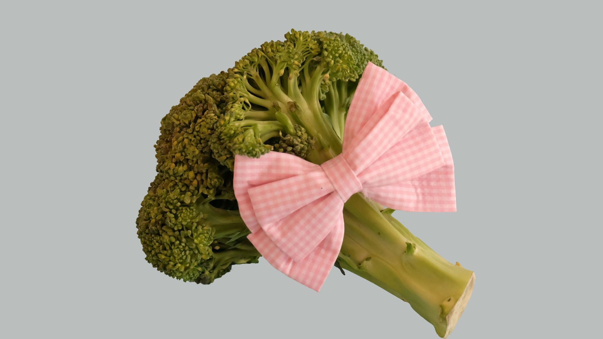 broccoli vegetable with pink ribbon