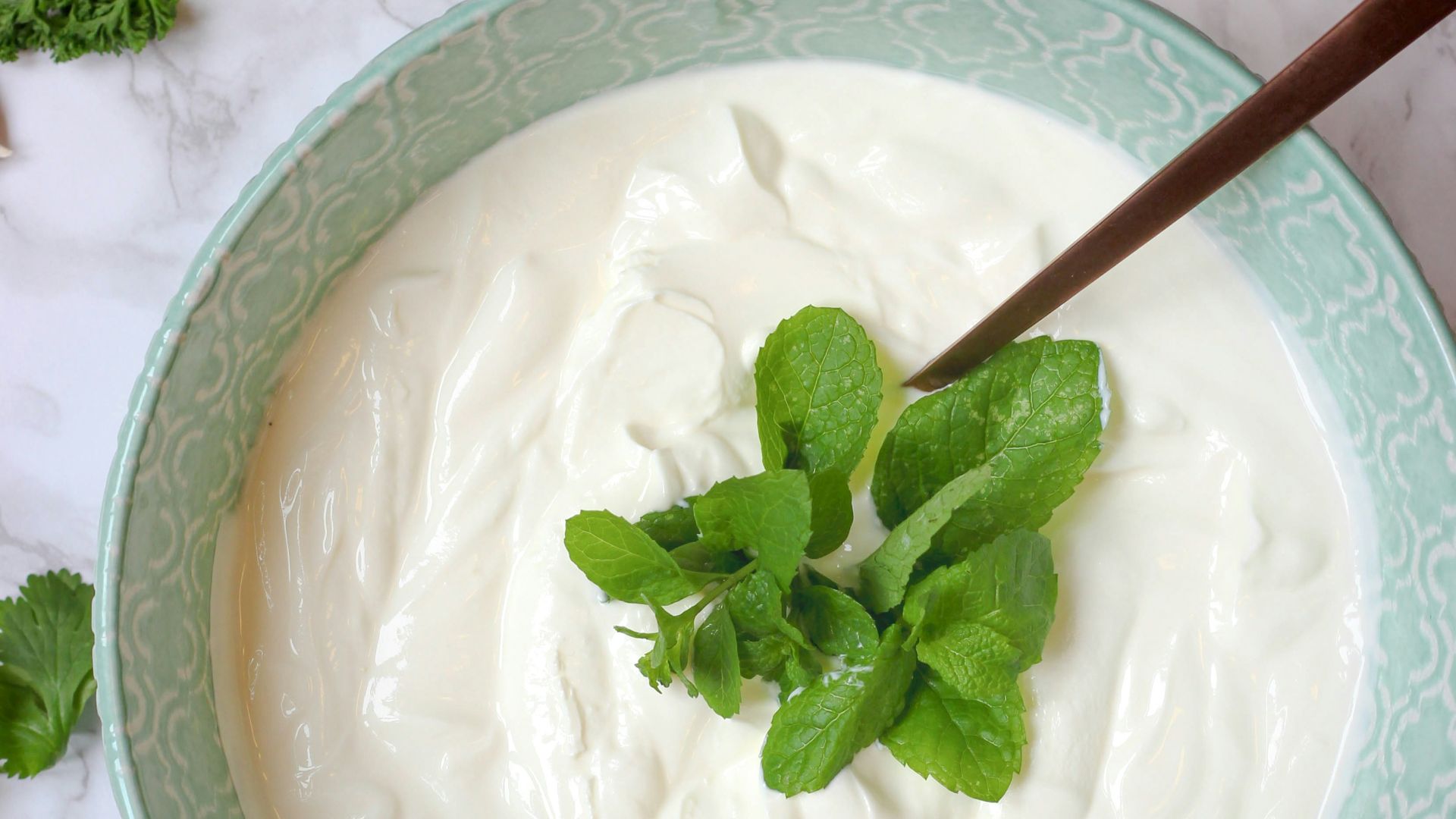 a bowl of yogurt with a spoon in it