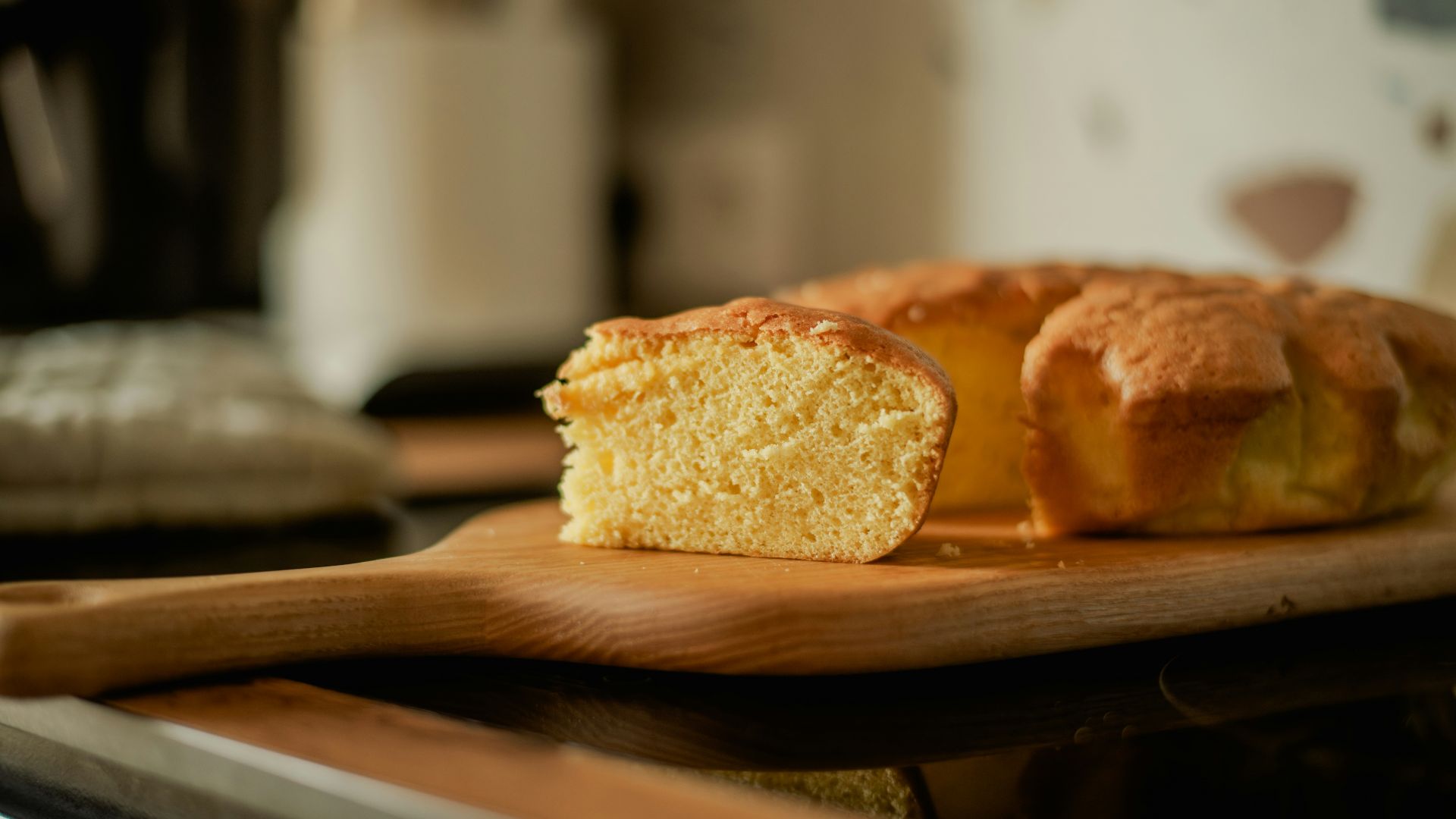A loaf of bread sitting on top of a wooden cutting board