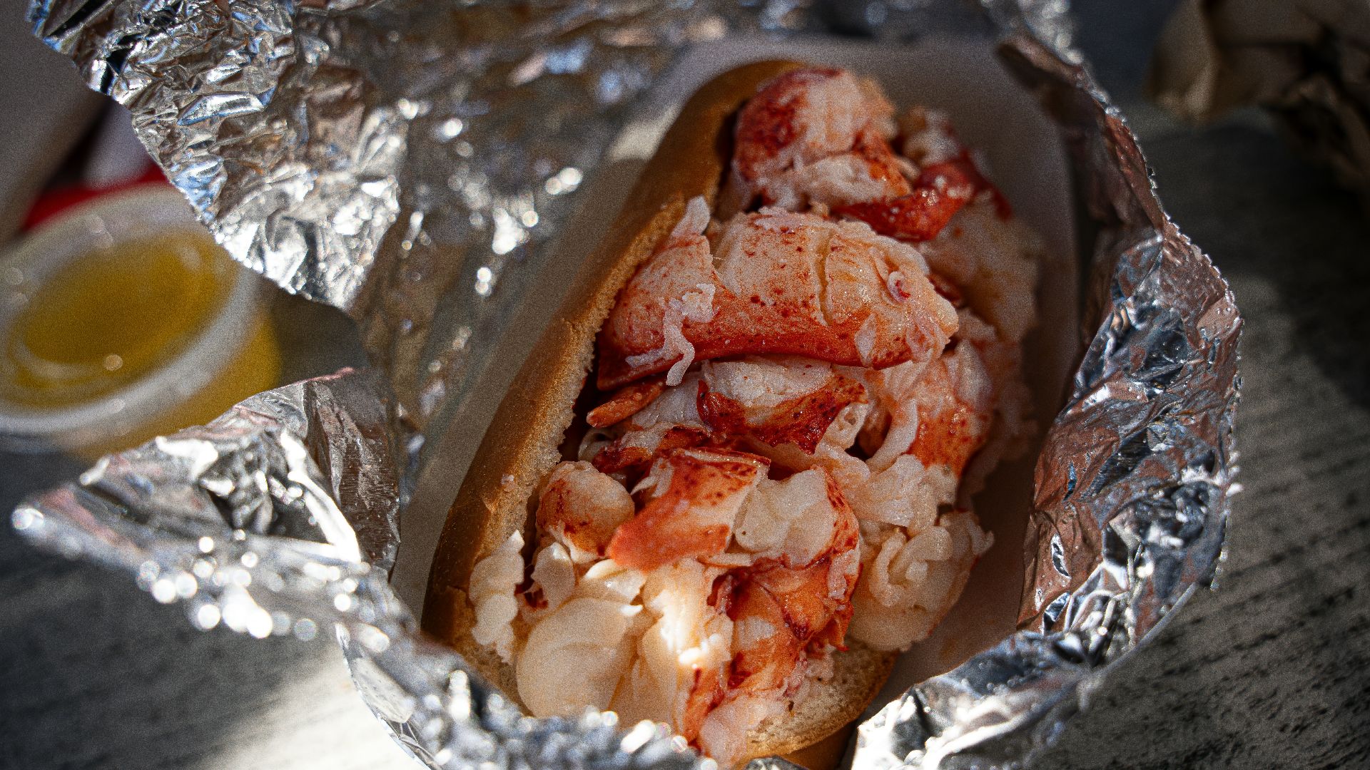 a hot dog covered in lots of toppings