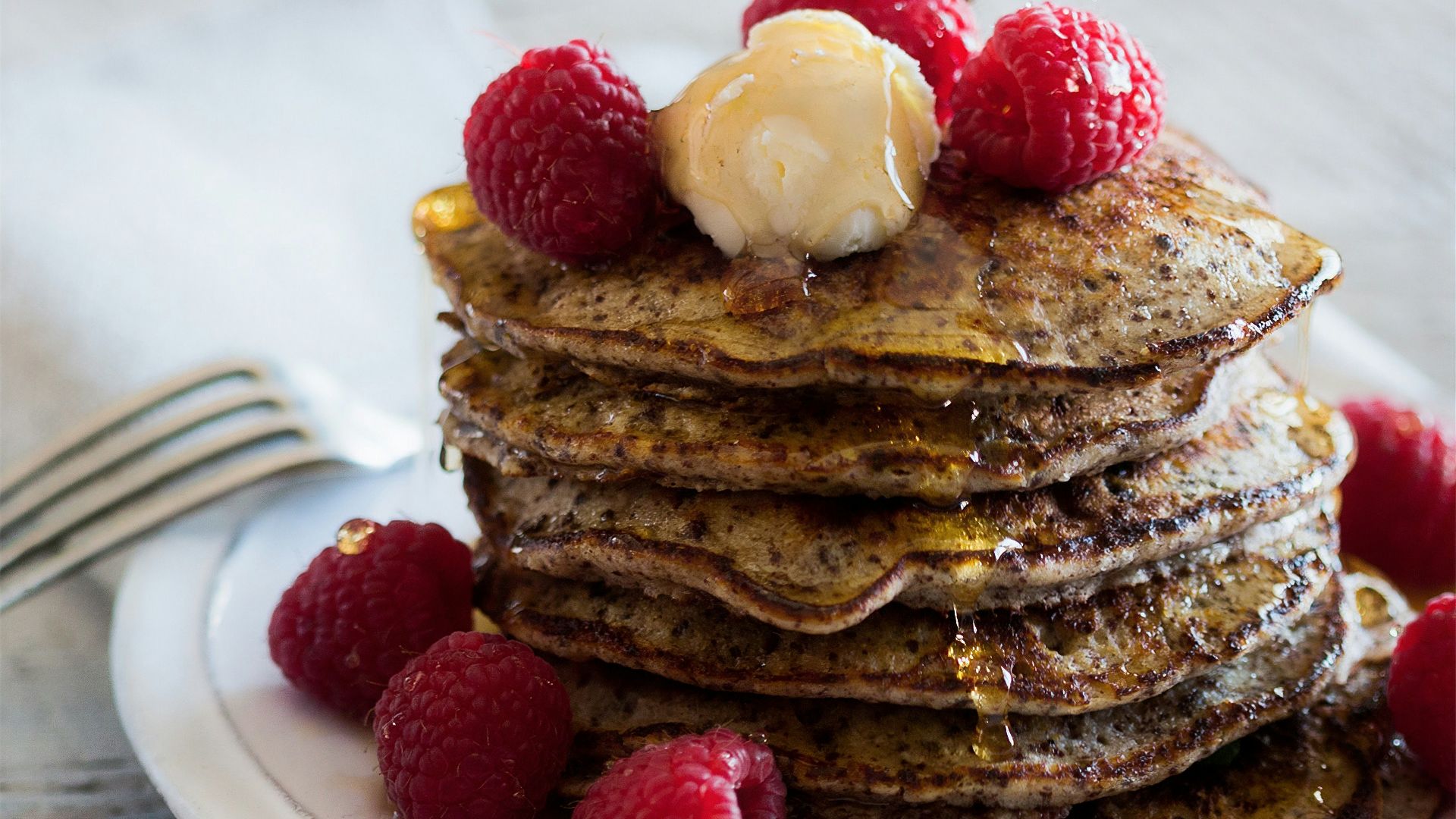 chocolate cake with white icing on white ceramic plate