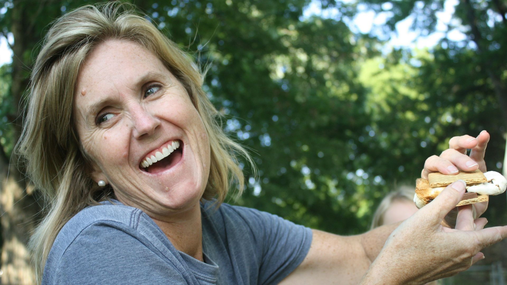 woman holding sandwich
