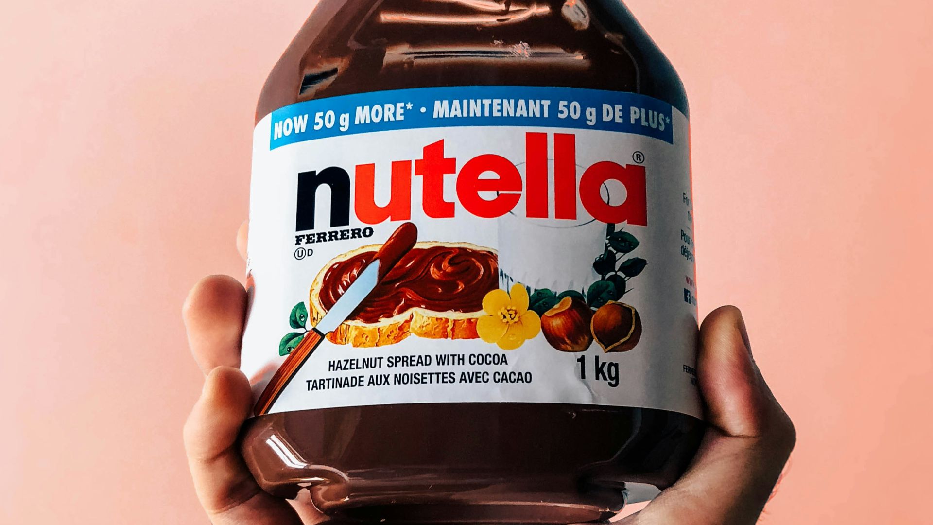 person holding Nutella jar