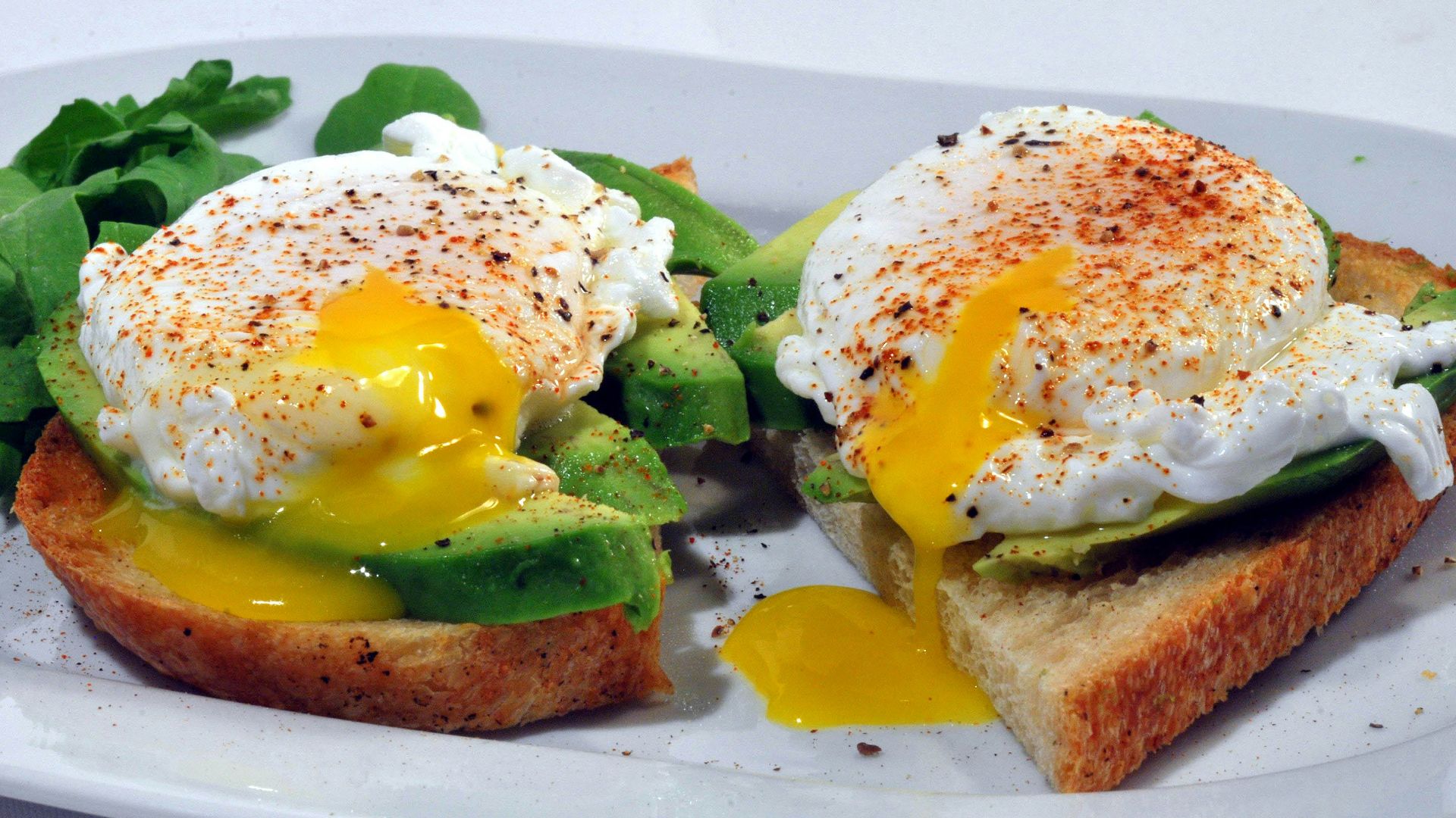 bread with egg and vegetable on white ceramic plate