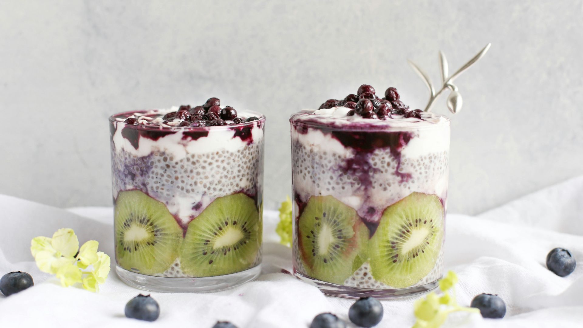 two fruit beverages on glass cups