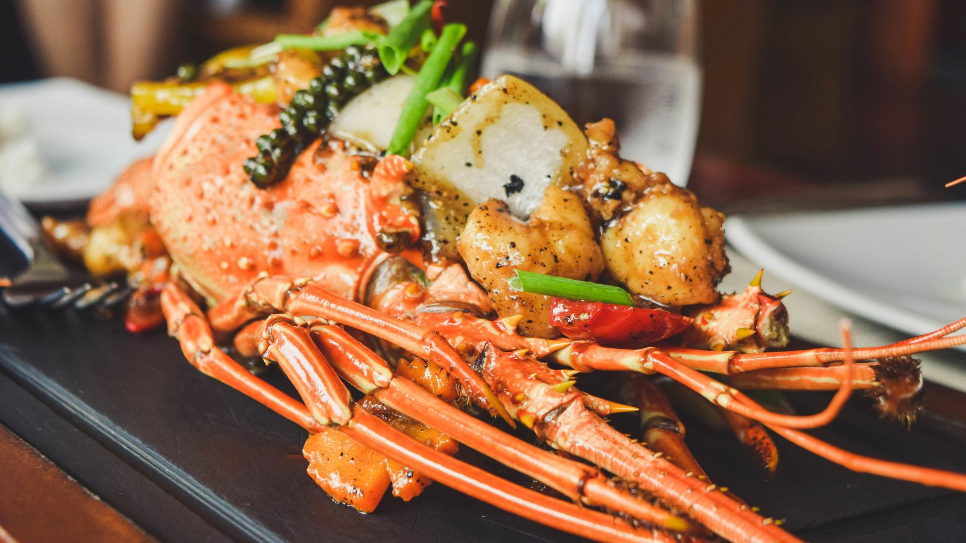 orange and white lobster on black tray