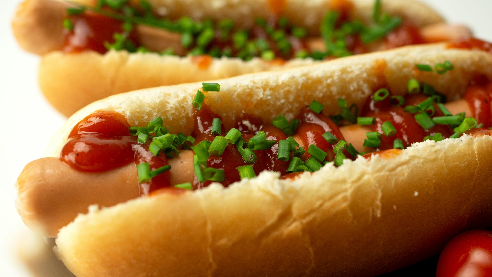 hotdog sandwich on white ceramic plate