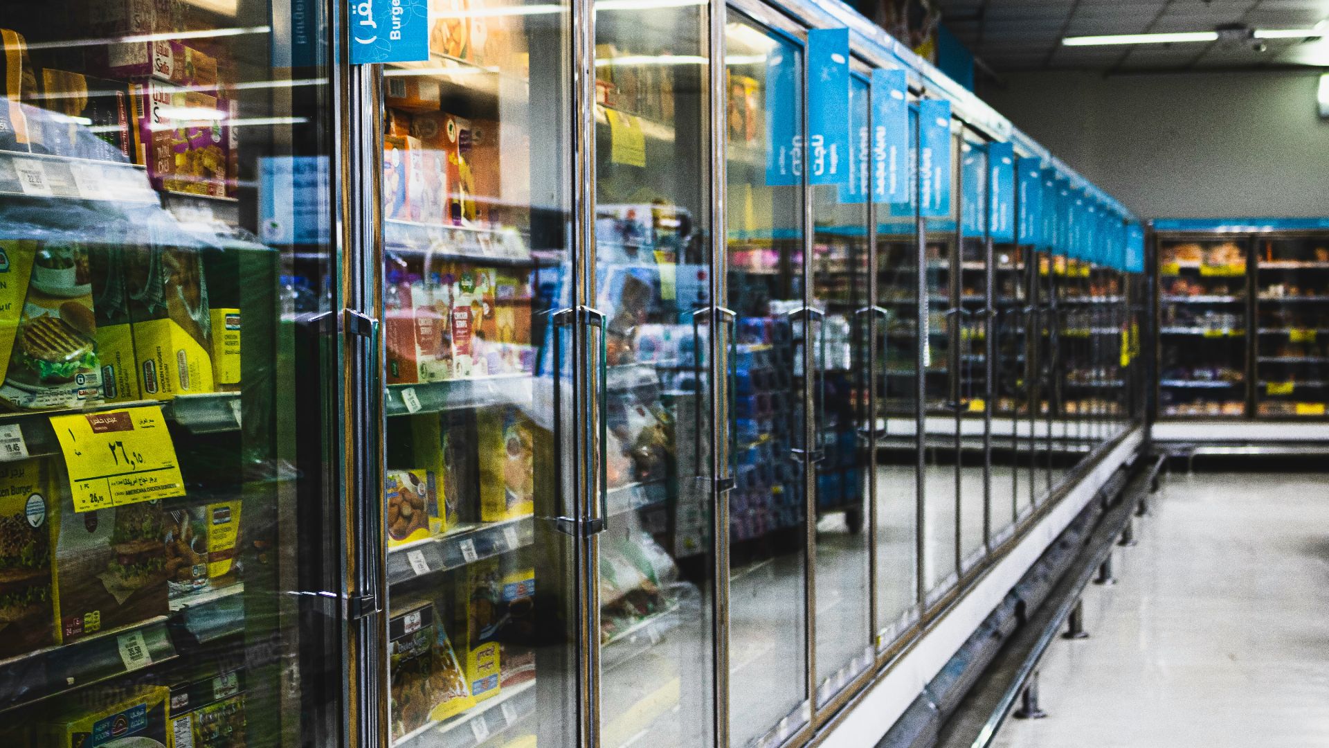 blue and white labeled plastic bottle in store