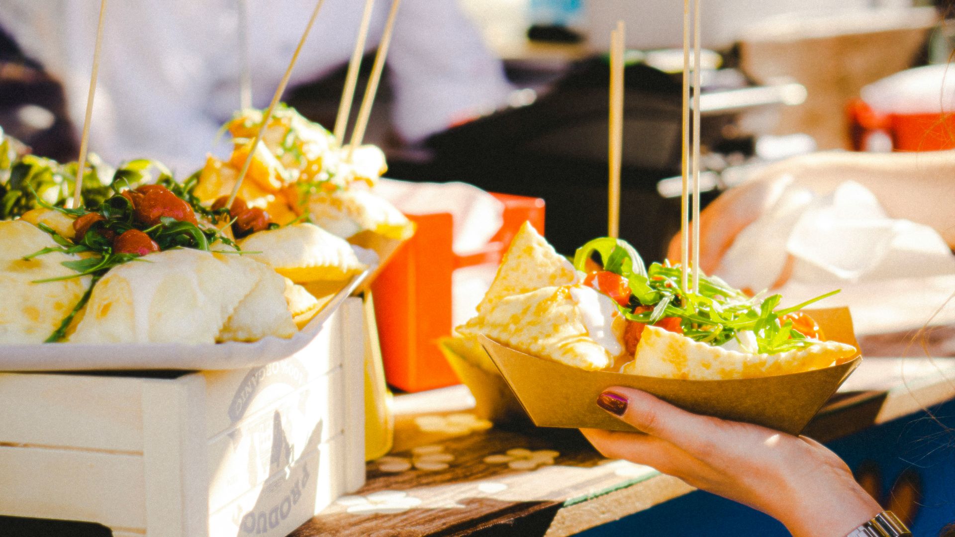 a woman is holding a bowl of food
