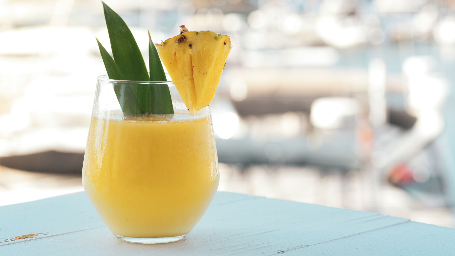 yellow juice in clear drinking glass