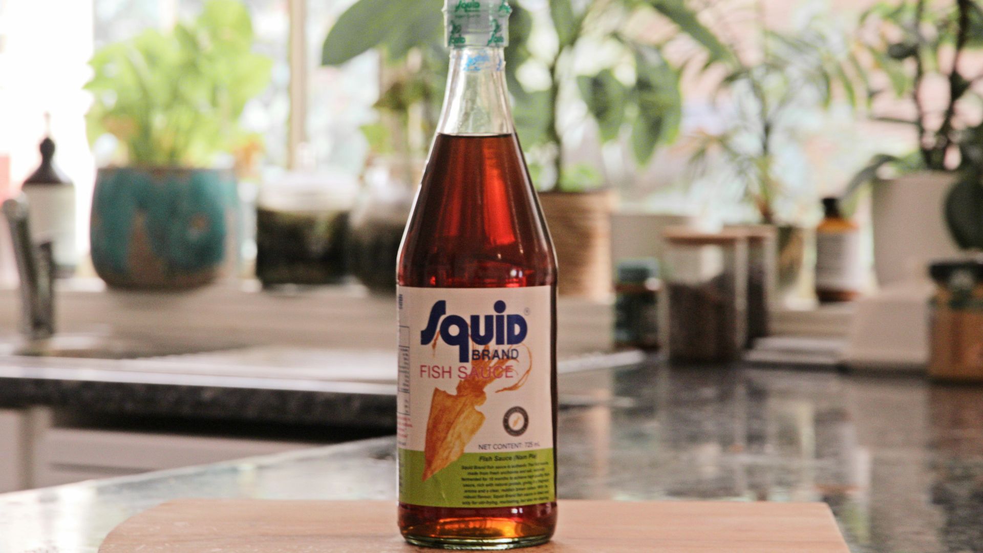 a bottle of liquid sitting on top of a counter