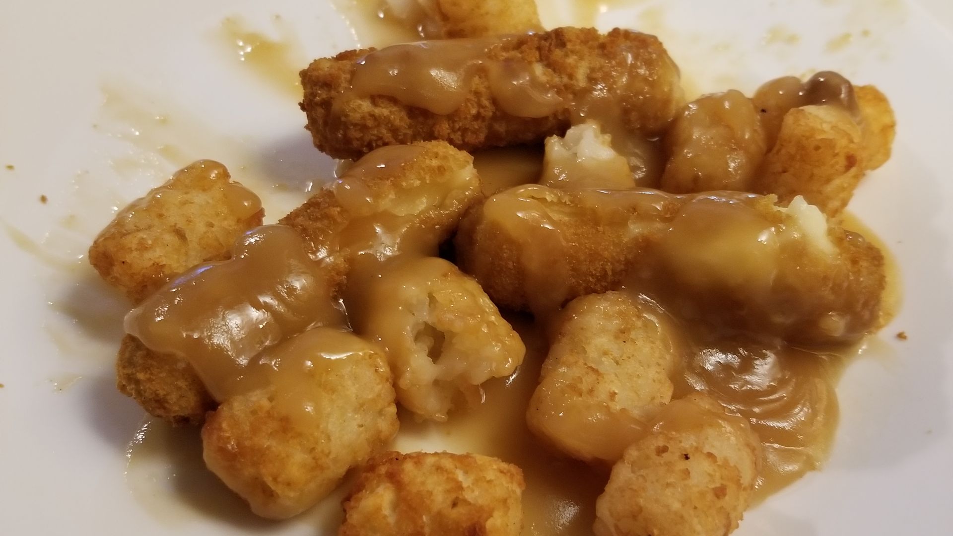 File:Mozzarella sticks and tater tots poutine.jpg