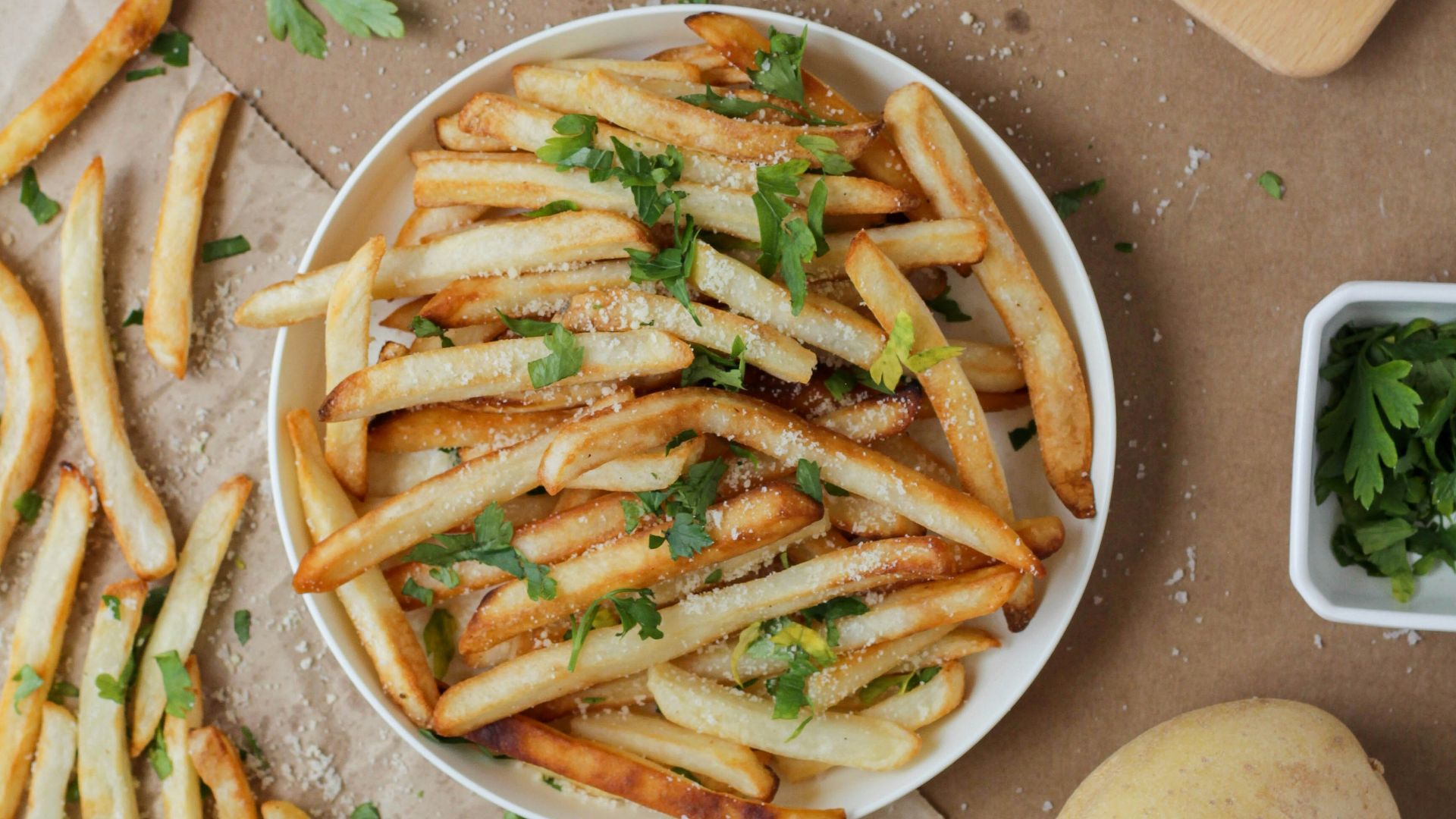 potato fries and sliced potato on white ceramic plate