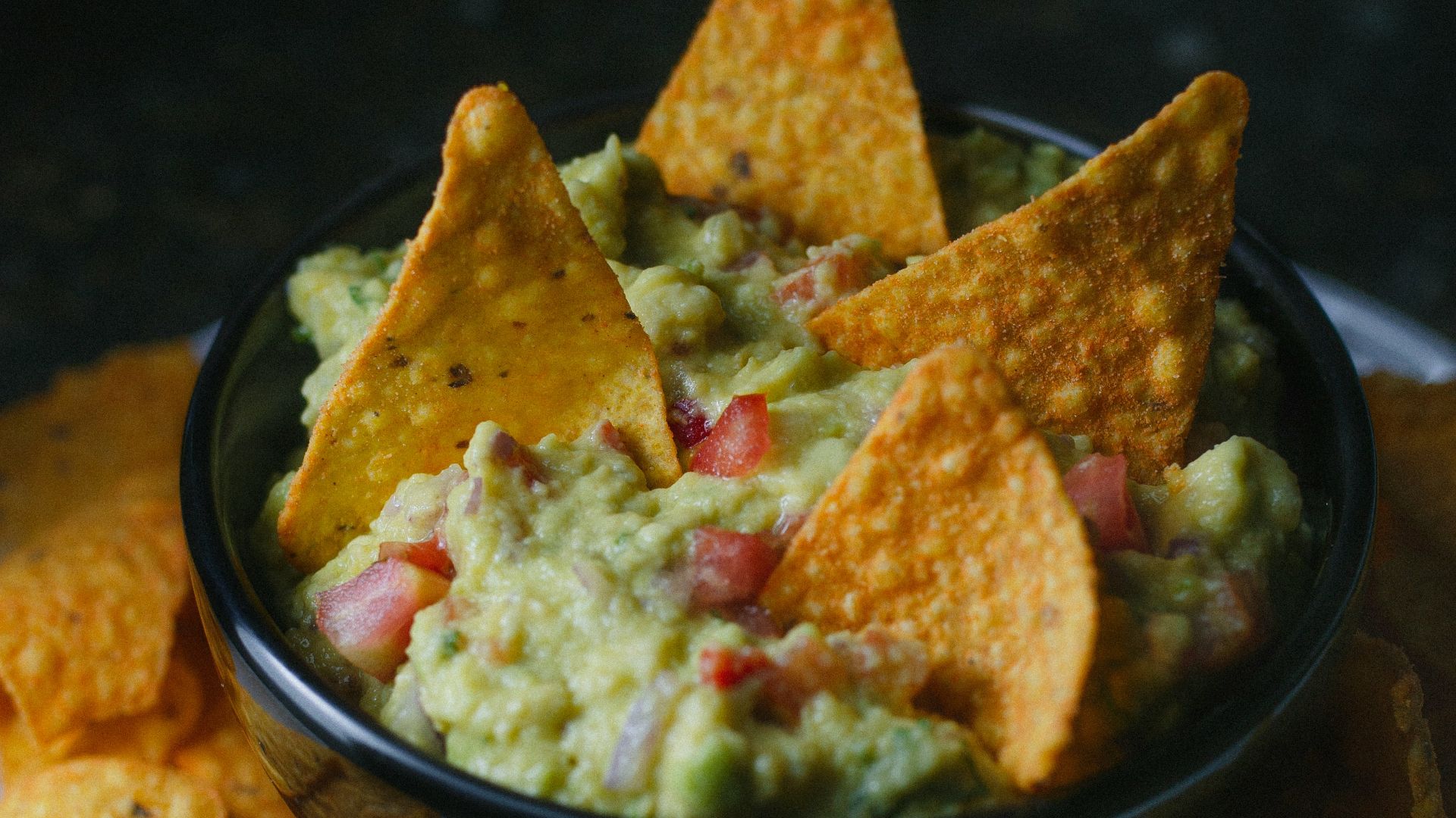 green vegetable on black ceramic bowl