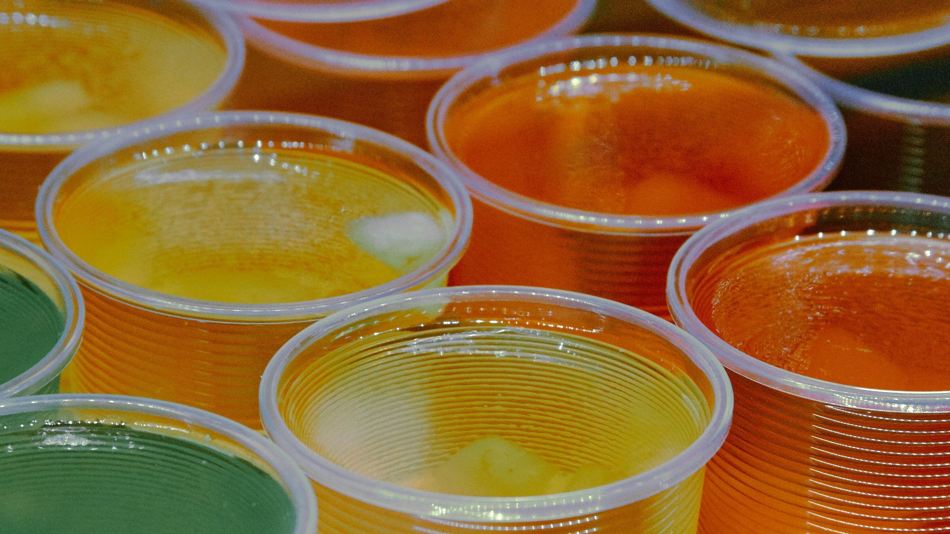 clear glass jars with yellow liquid
