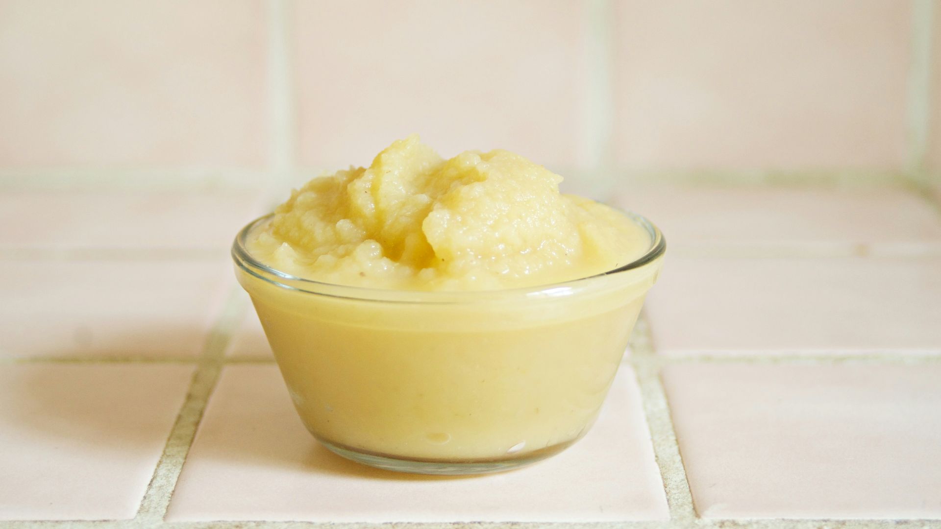yellow cream in clear glass bowl