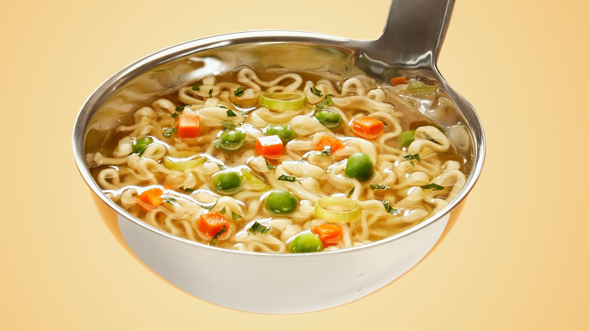 silver steel scoop with noodles