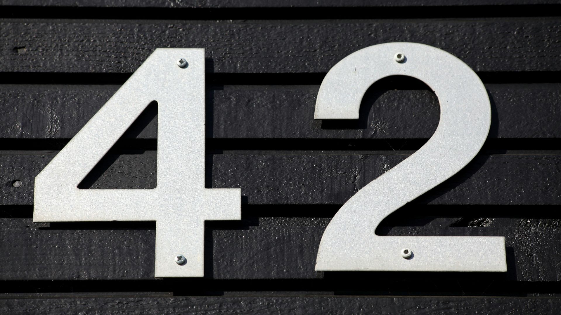 black and white arrow sign