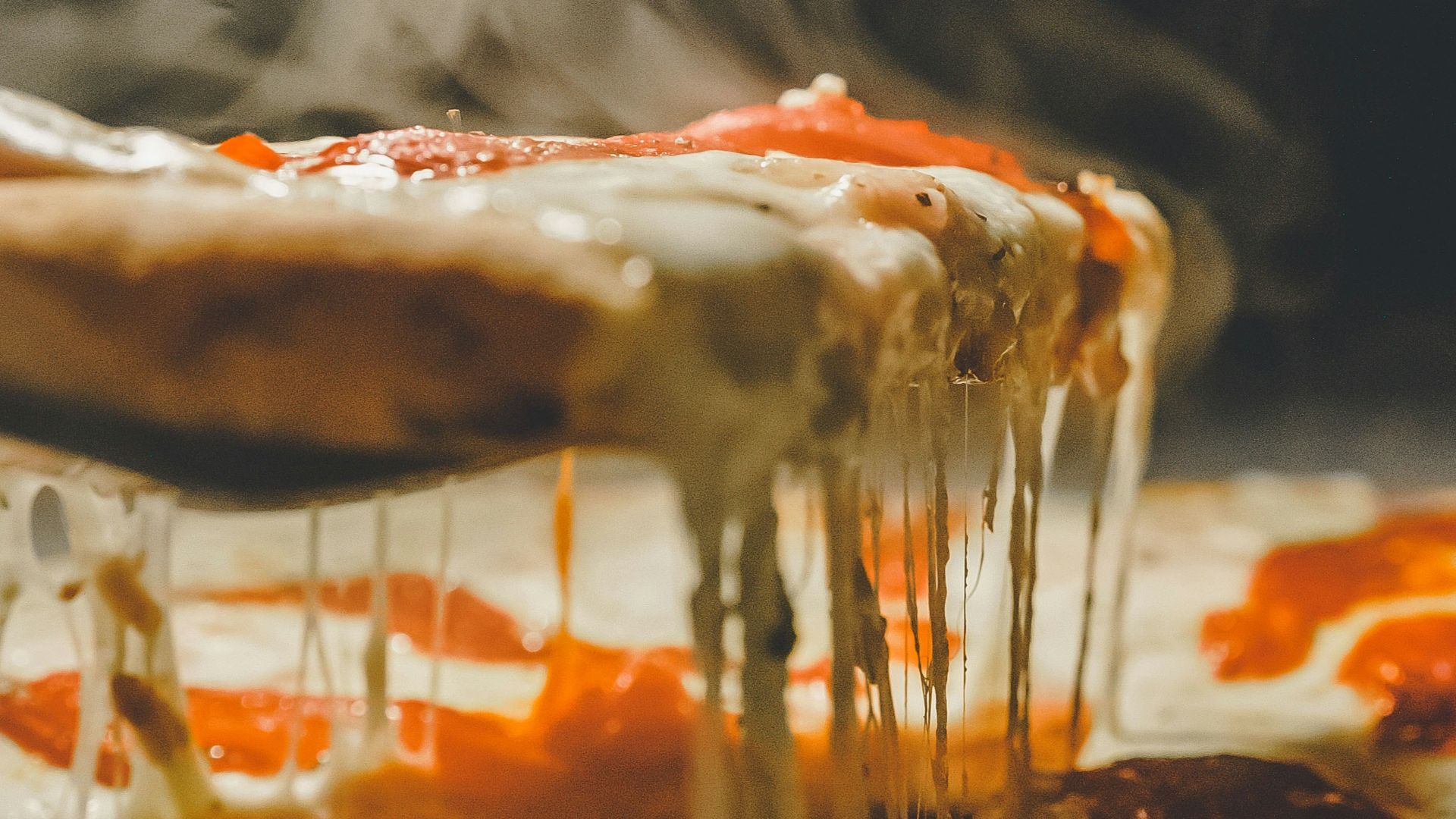 close up photo of pizza with cheese