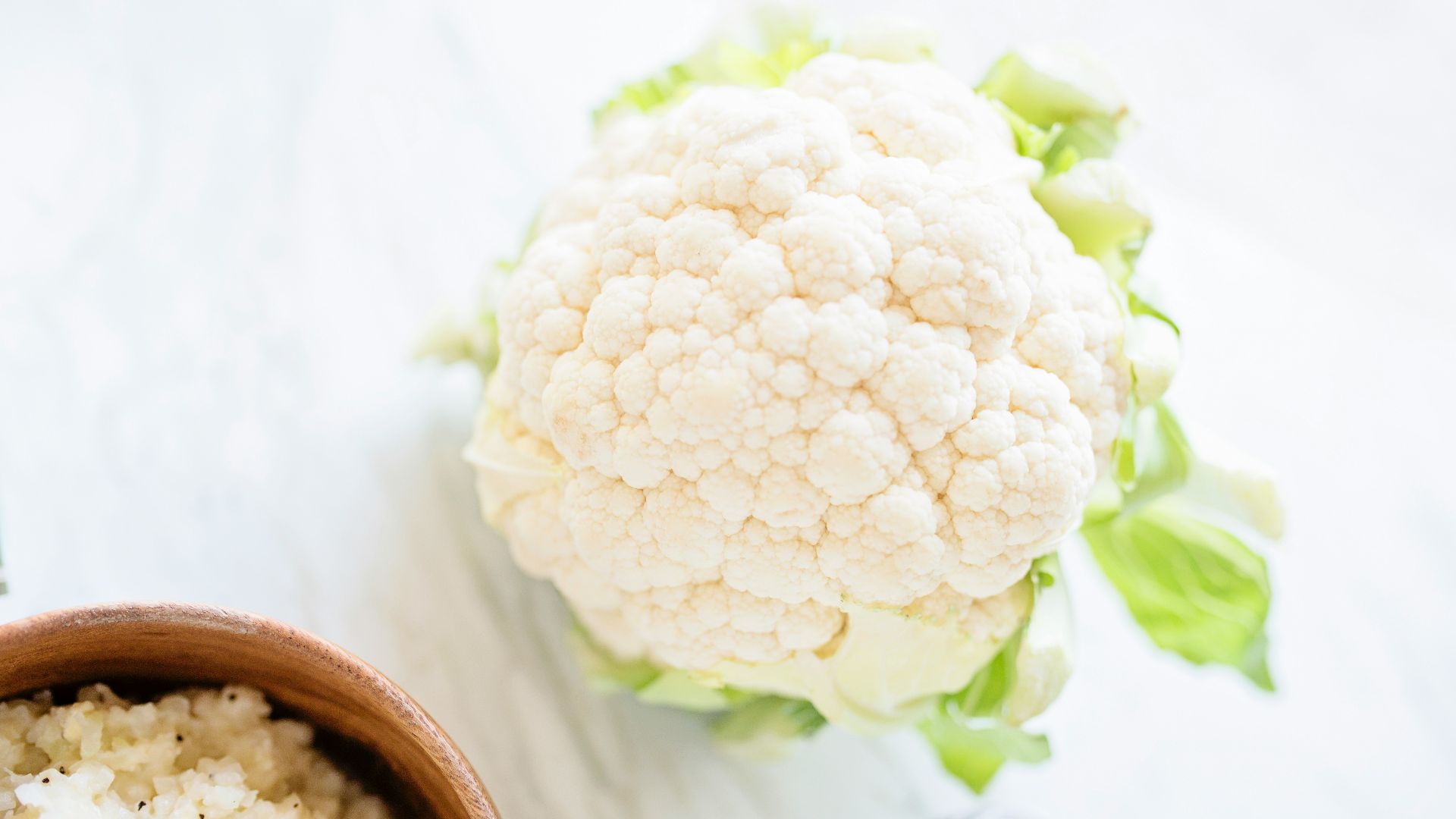 white flower on brown wooden round pot
