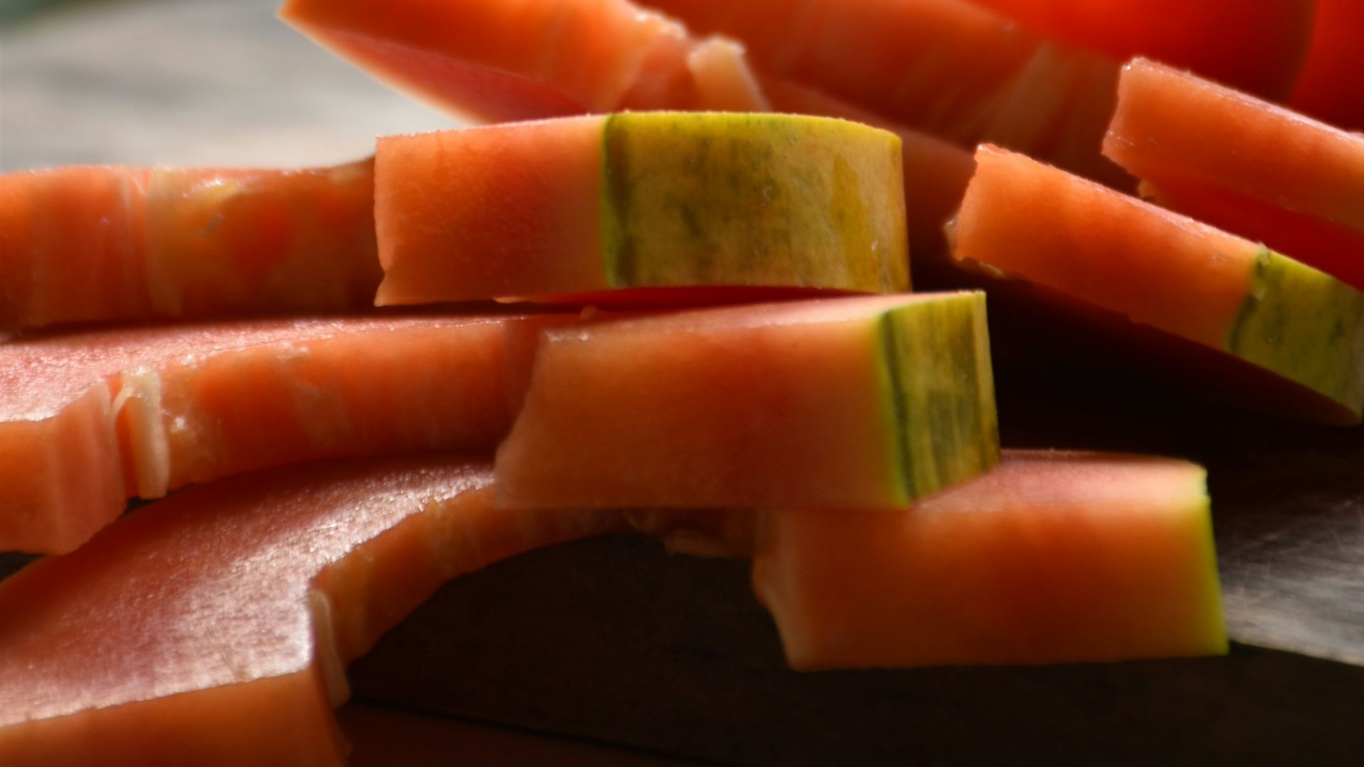 a cutting board topped with sliced up vegetables
