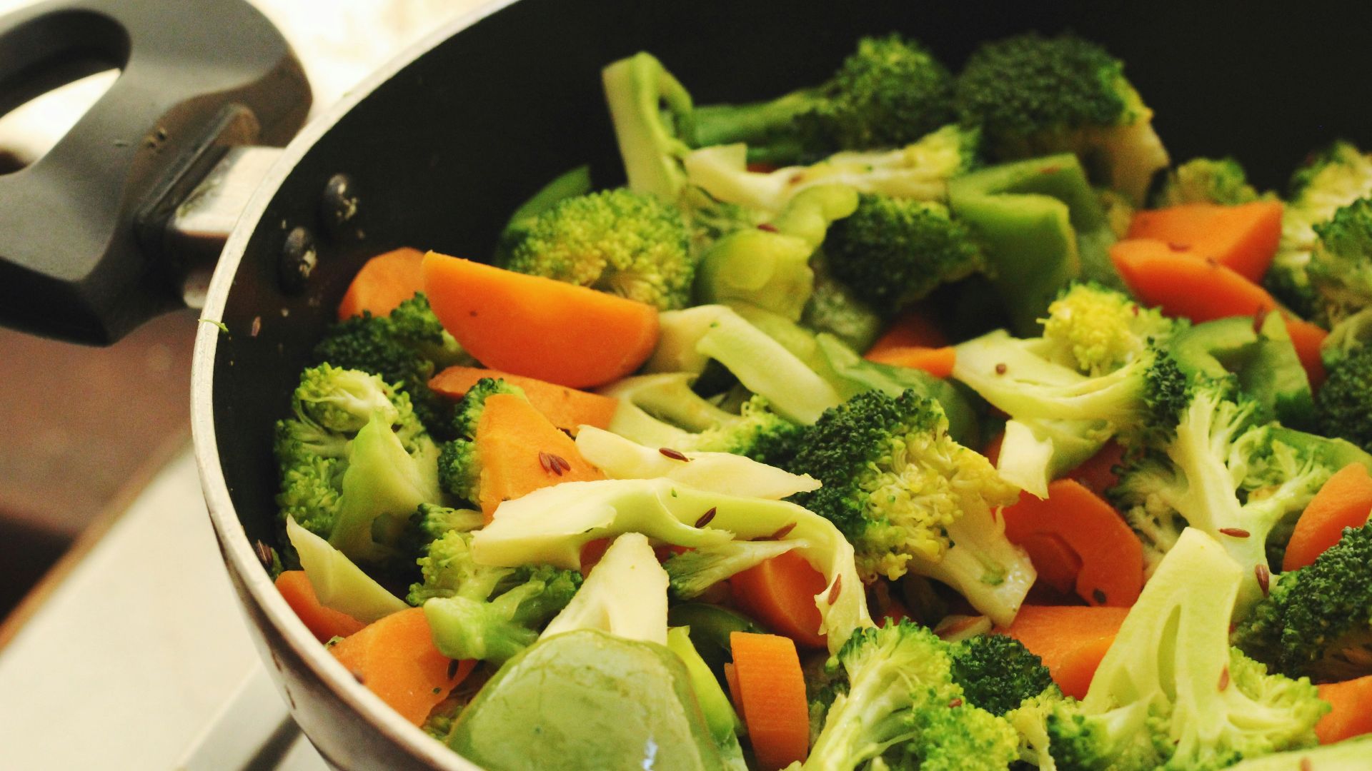 green and orange vegetable salad in white ceramic bowl