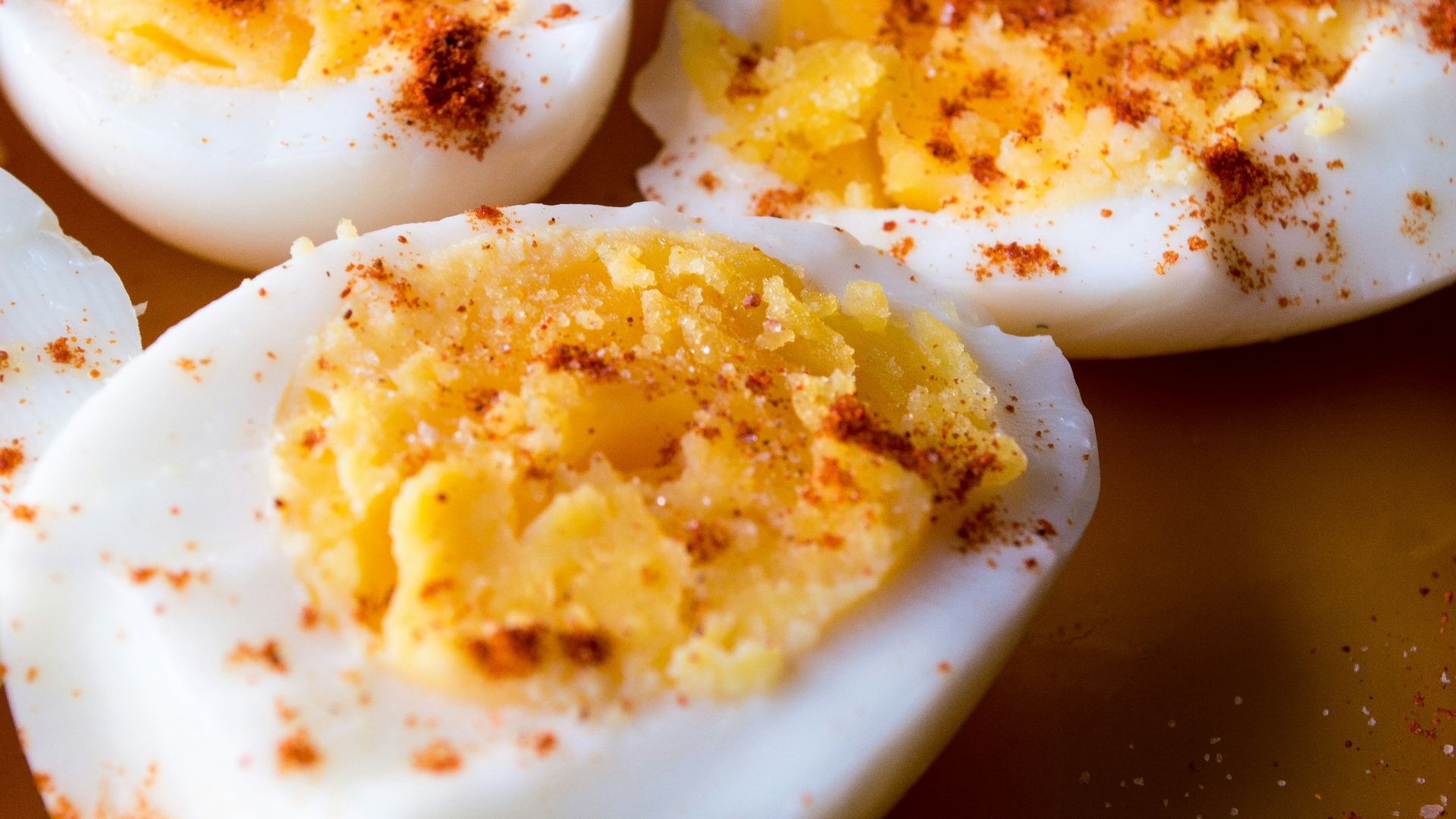 sliced boiled eggs topped with spices