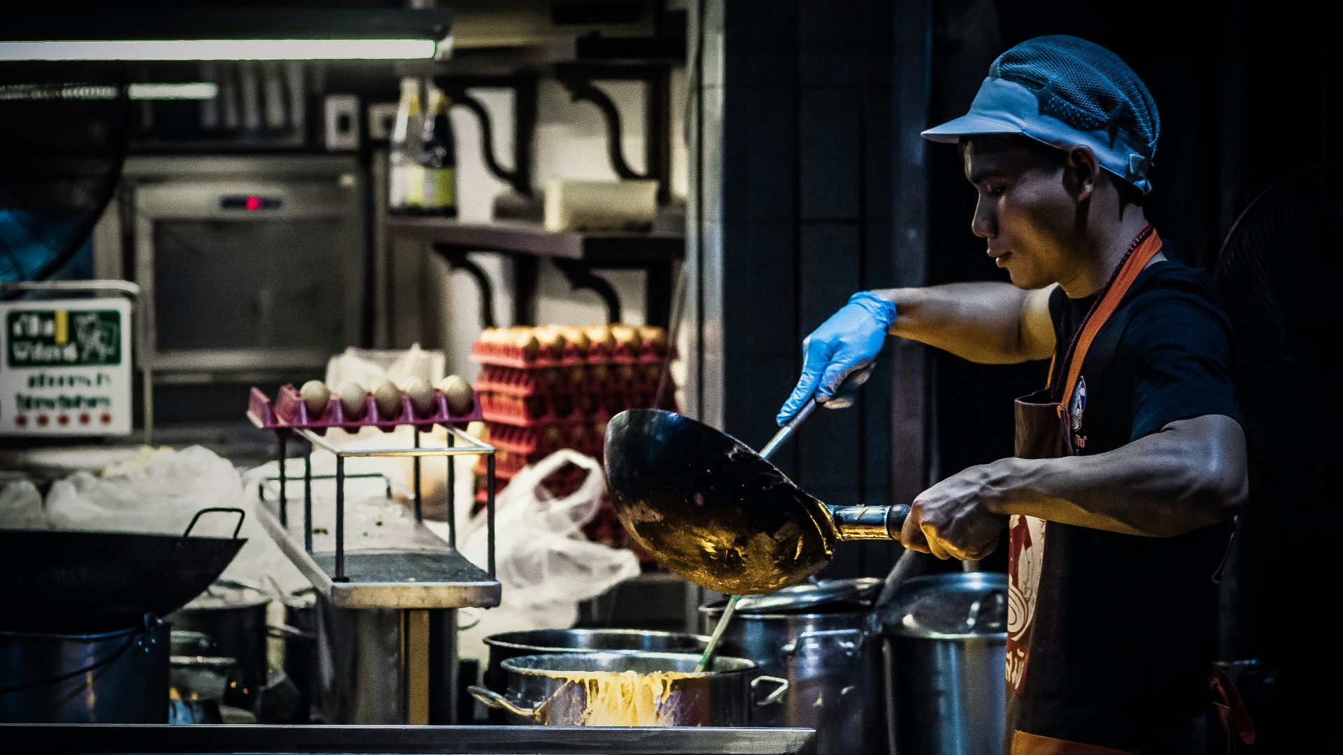man cooking in kitchen