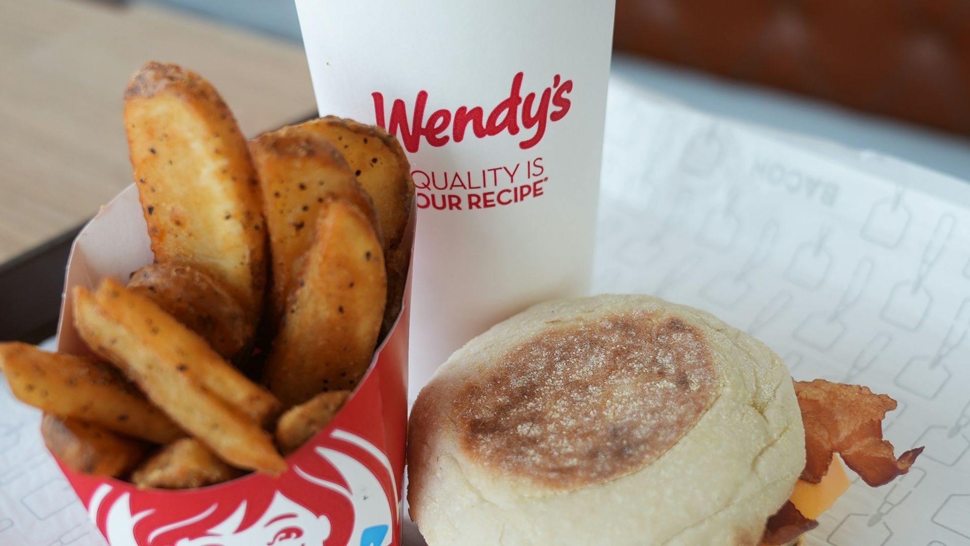 A tray with a sandwich and fries on it